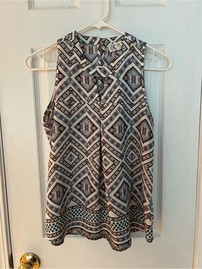 Flowy, sleeveless top, with unique pattern.